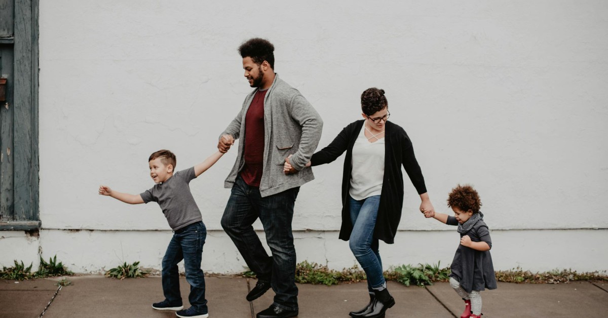 Untitled Design – 2024-12-01T084003.373 happy adoptive family walking in Kentucky