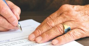 hands working on legal paperwork